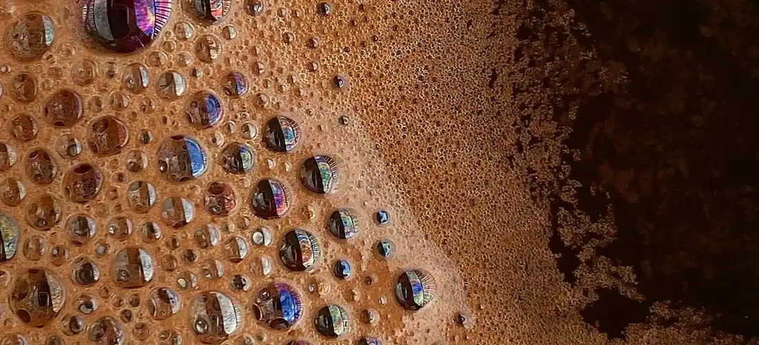 Close-up view of foamy bubbles rising in a hot tub
