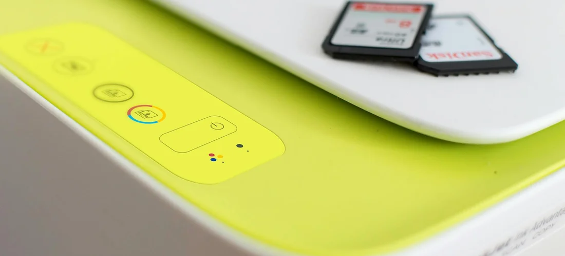 Close-up of a hot tub control panel with a yellow touch area and a memory card inserted