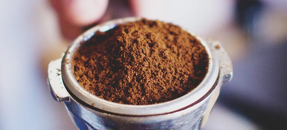Close-up of a hot tub filter filled with brown sediment, indicating a dirty or clogged filter