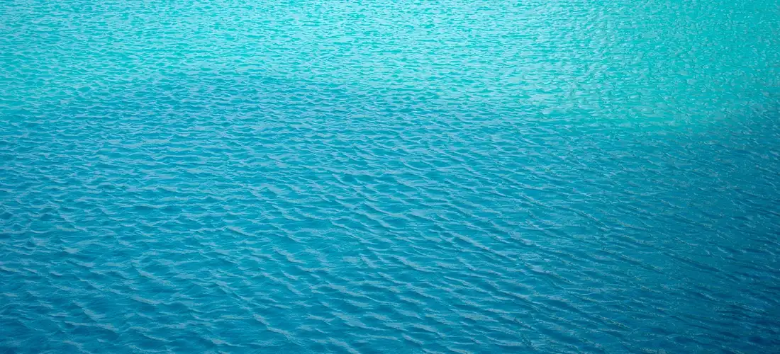 Blue hot tub water surface with gentle ripples